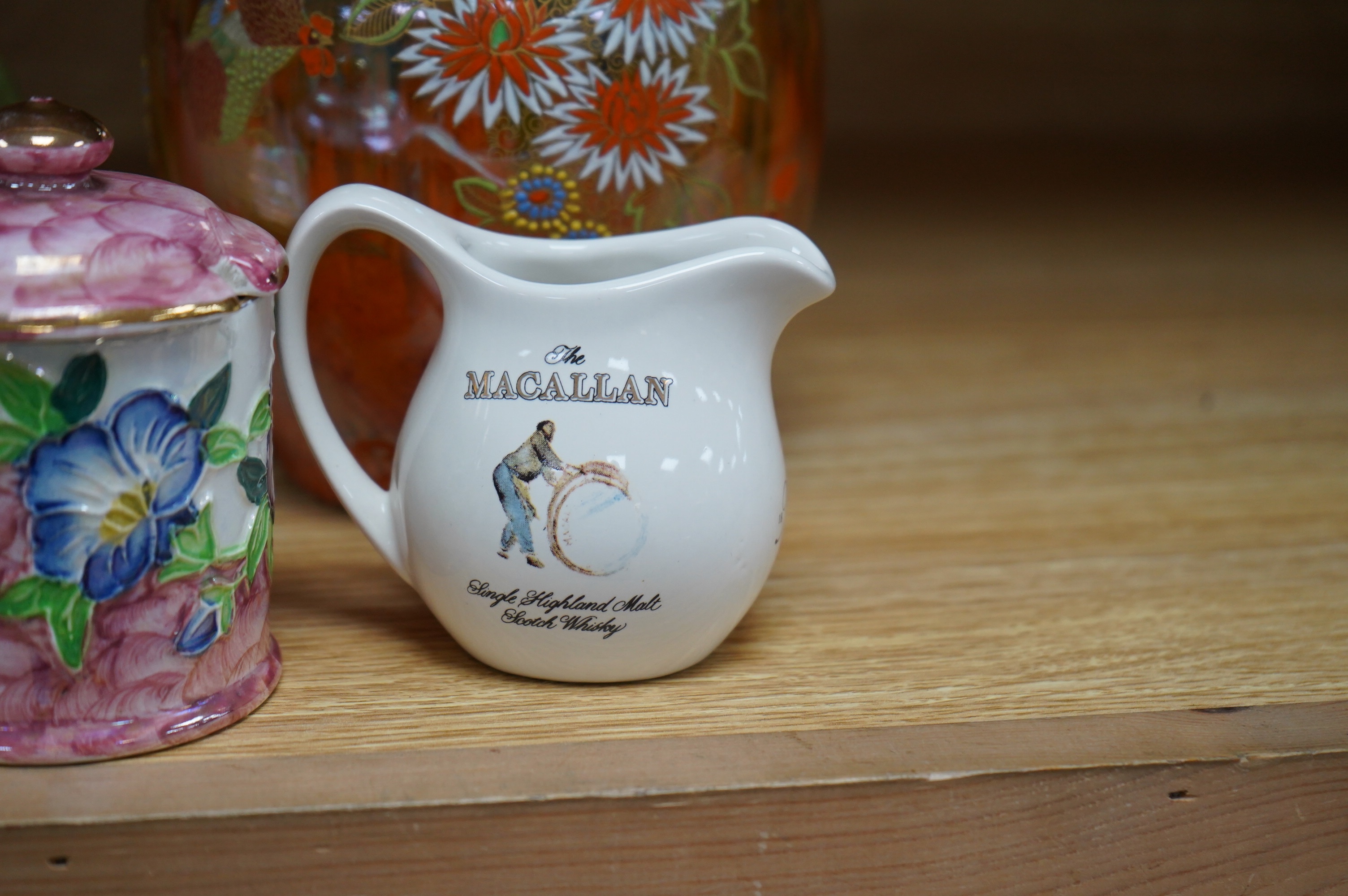 A Maling pink peony honey pot, a Carltonware lustre ‘cockerels’ vase, a similar jug, a Grays pottery dish and a Macallan whisky jug, tallest 14cm. Condition - good